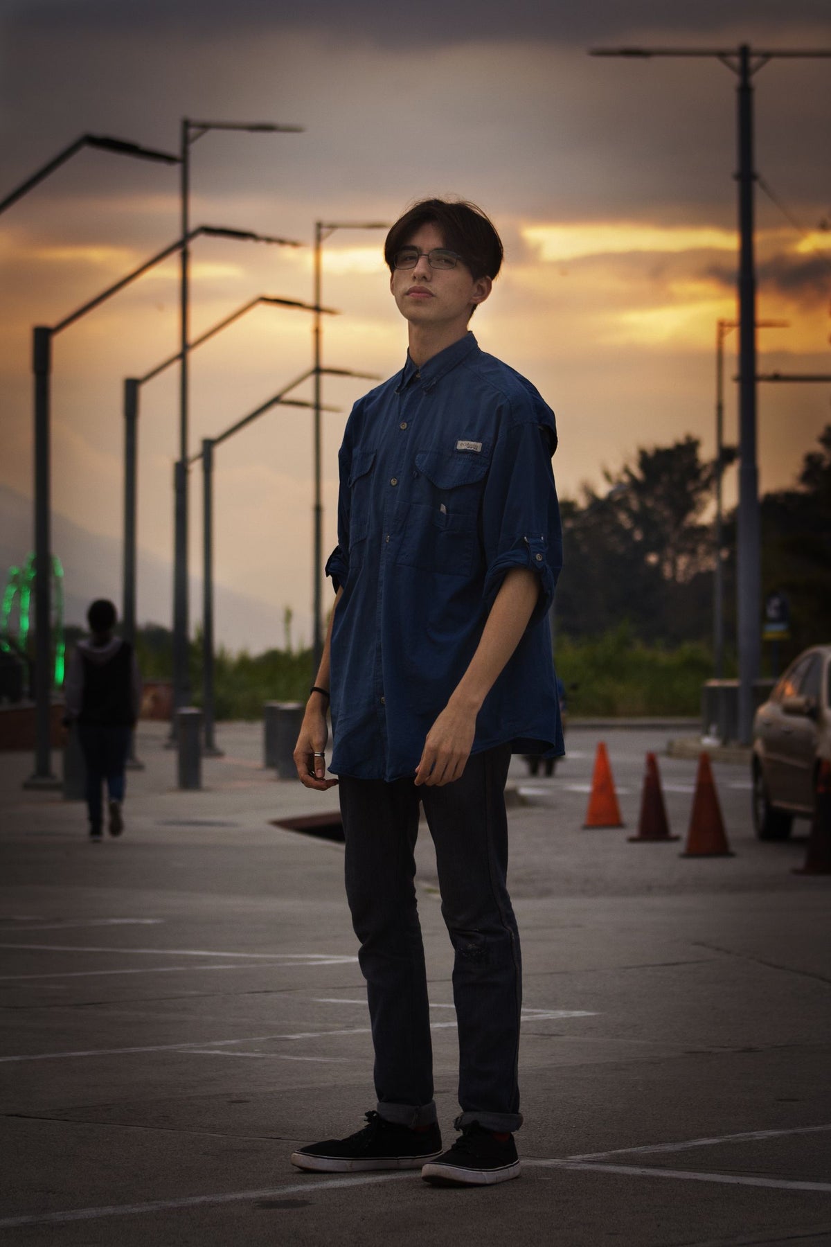 Man wearing a sky blue button-up shirt outdoors at golden hour, sky blue co-ord set styling inspiration for men in India