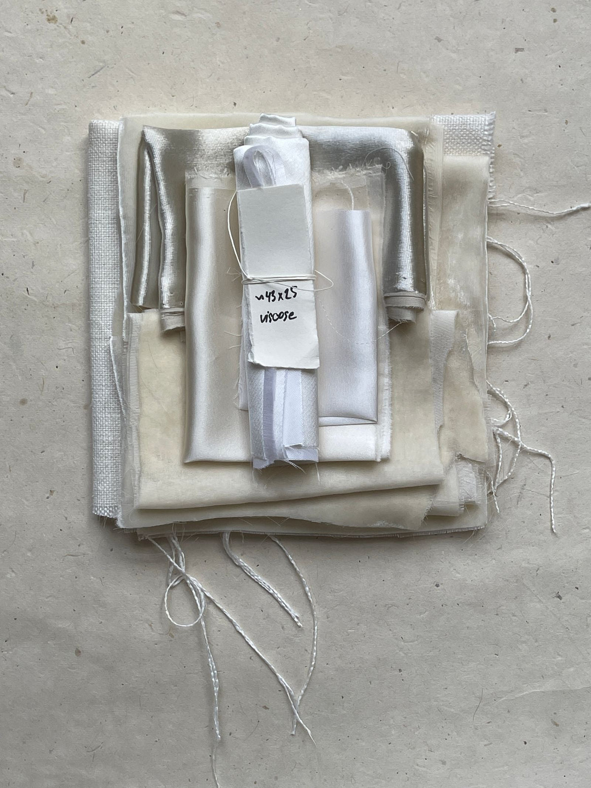 Neutral fabric swatches stacked on linen - best men's co-ord sets under 3000 rupees in India