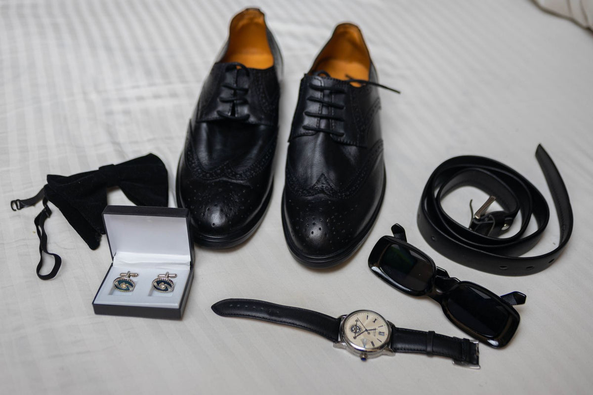 Men's fashion accessories flat lay with watch, sunglasses and leather shoes for styling a co-ord set