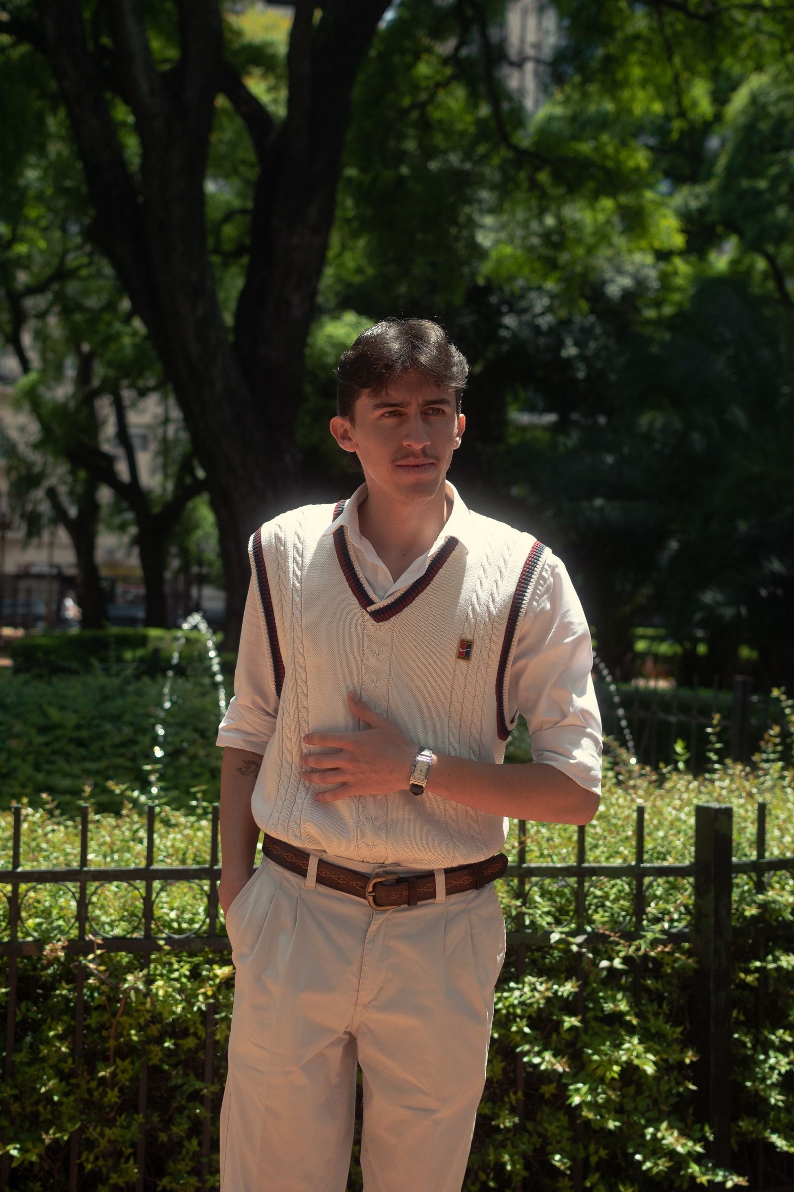Elegant young man in classic old money style outfit outdoors — quiet luxury menswear inspiration for Indian men