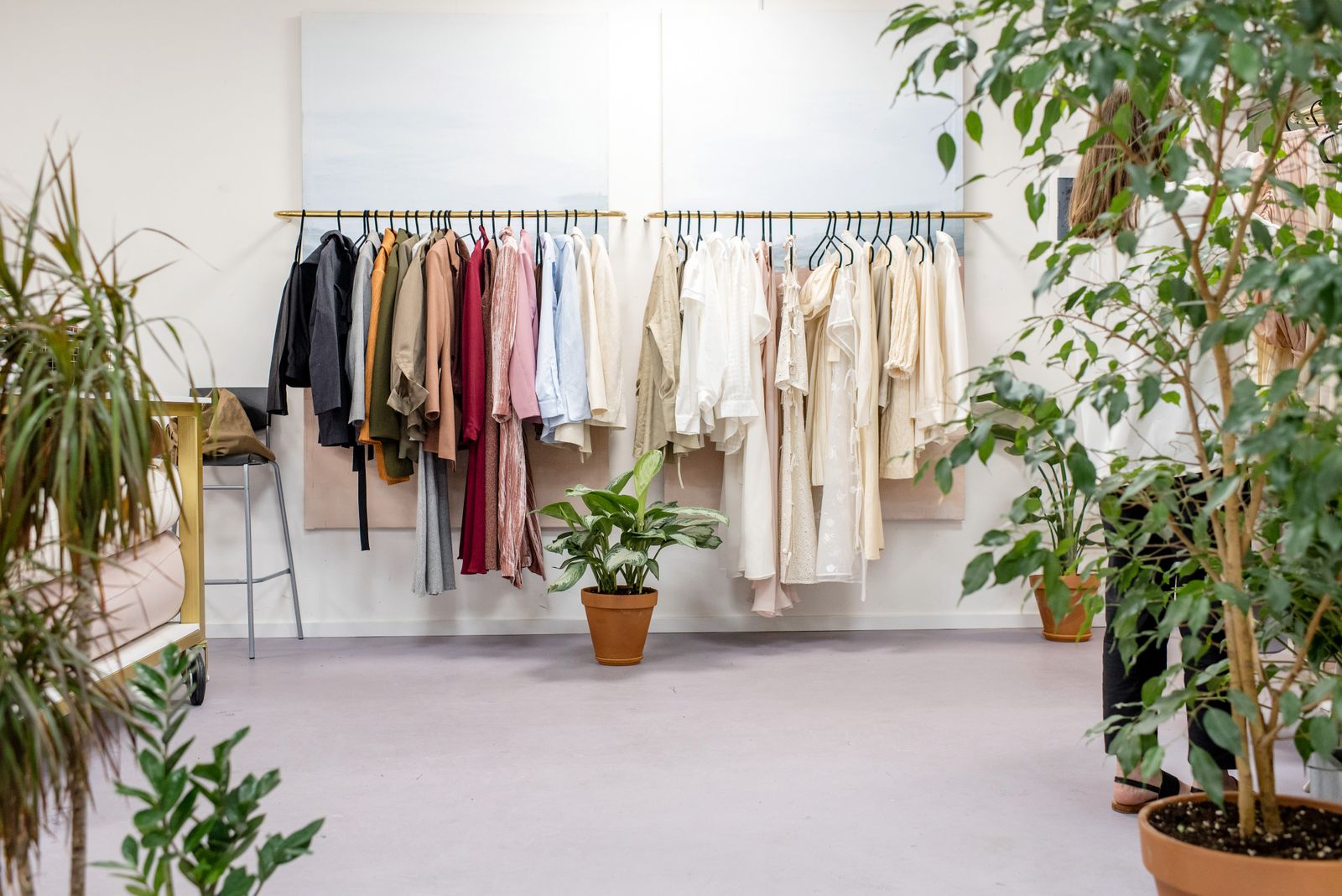 Curated outfits hanging on a clothes rack - how to style a men's co-ord set