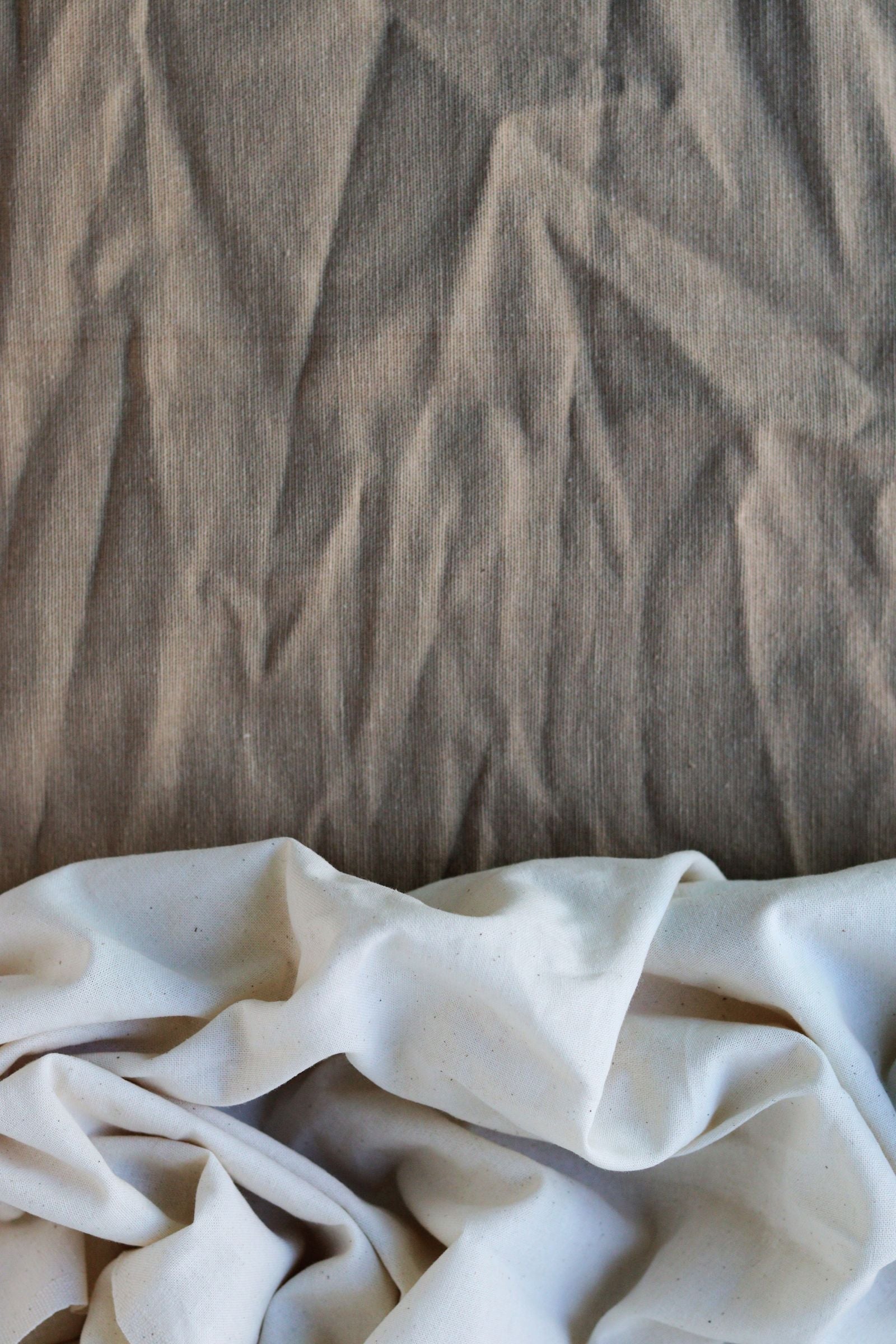 Close-up of natural linen fabric texture — linen vs viscose rayon comparison for men's summer wear