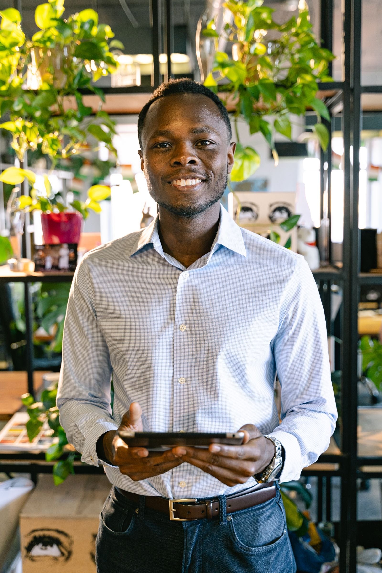 Man wearing a smart casual co-ord set style outfit in a modern office