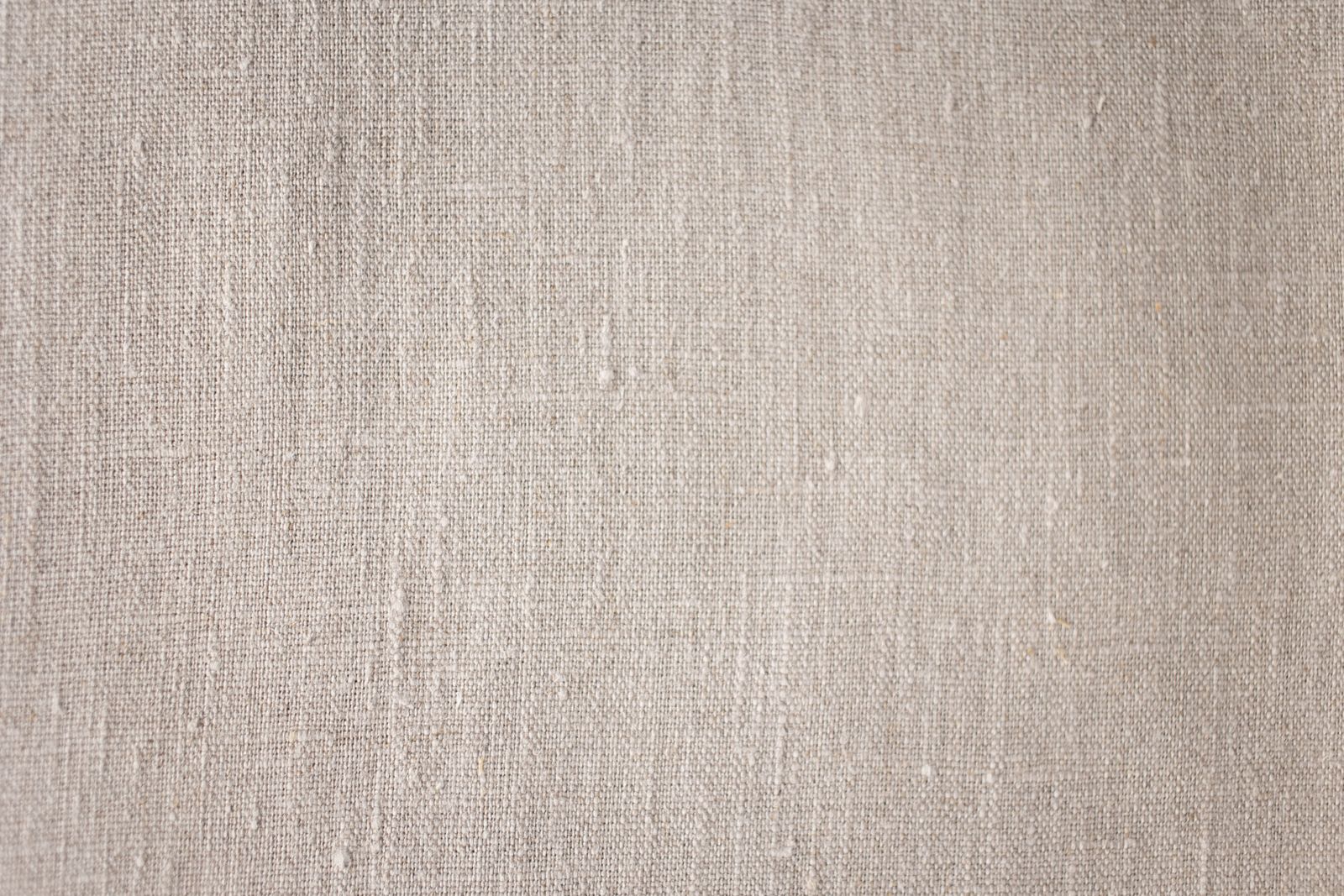 Close-up macro of natural linen fabric weave - cotton-linen blend vs pure linen comparison