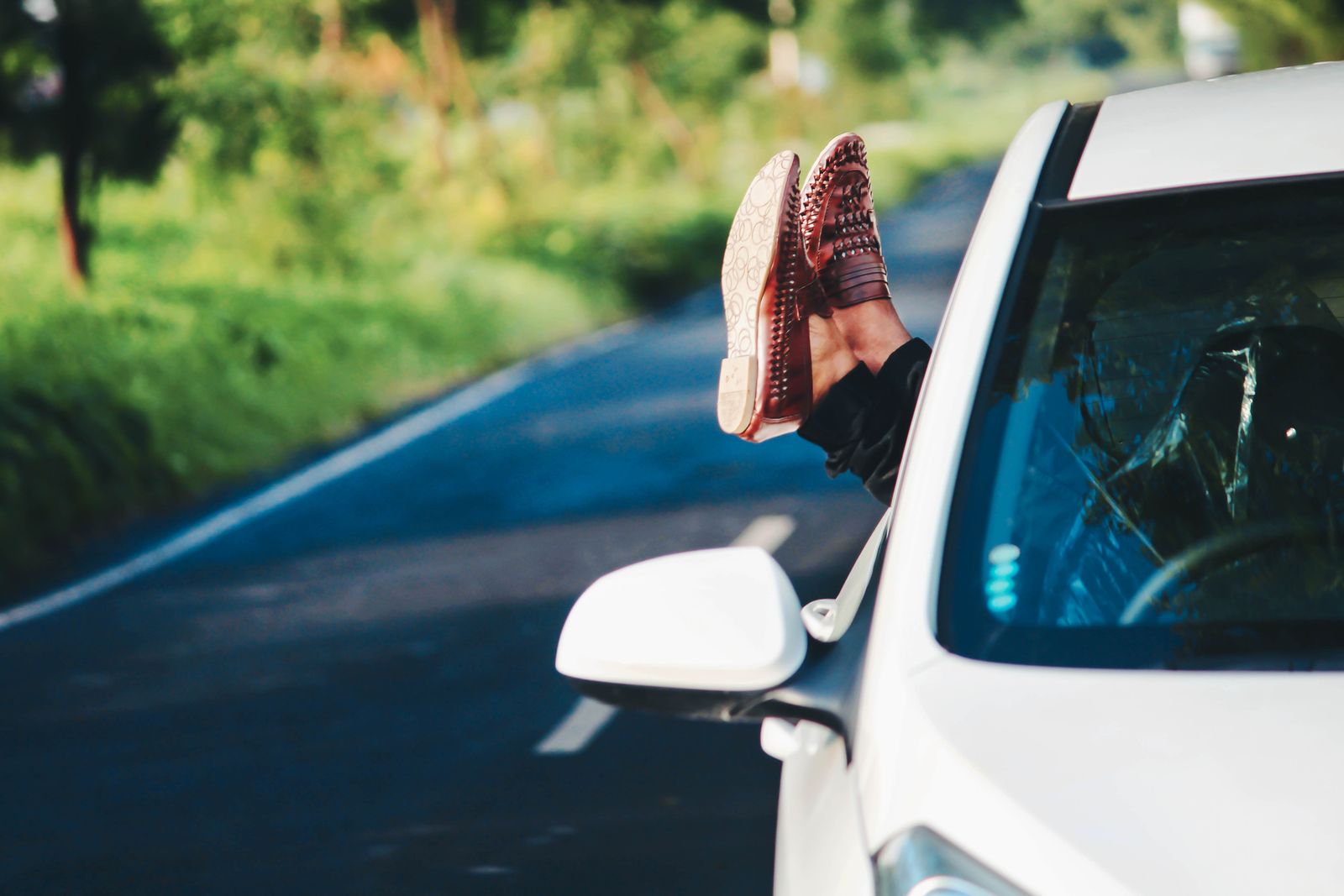 Brown leather loafers worn with trousers — the best shoes to wear with a men's linen co-ord set