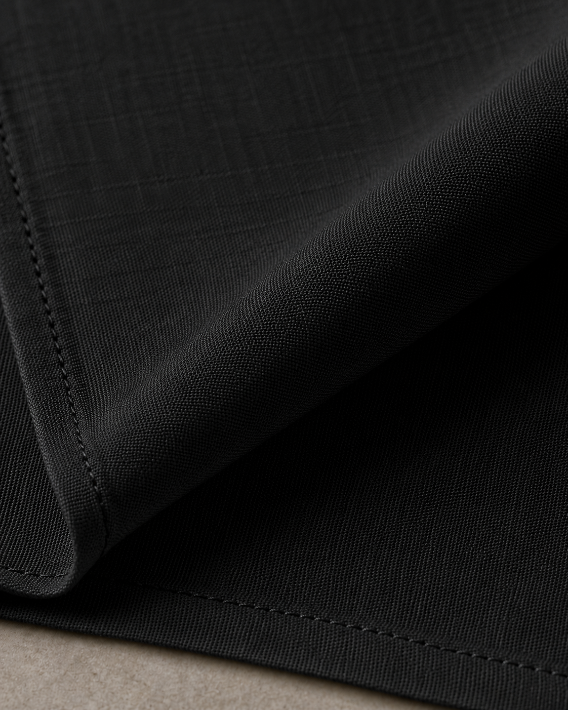 Close-up of the black 225 GSM Premium Linen slub weave fabric