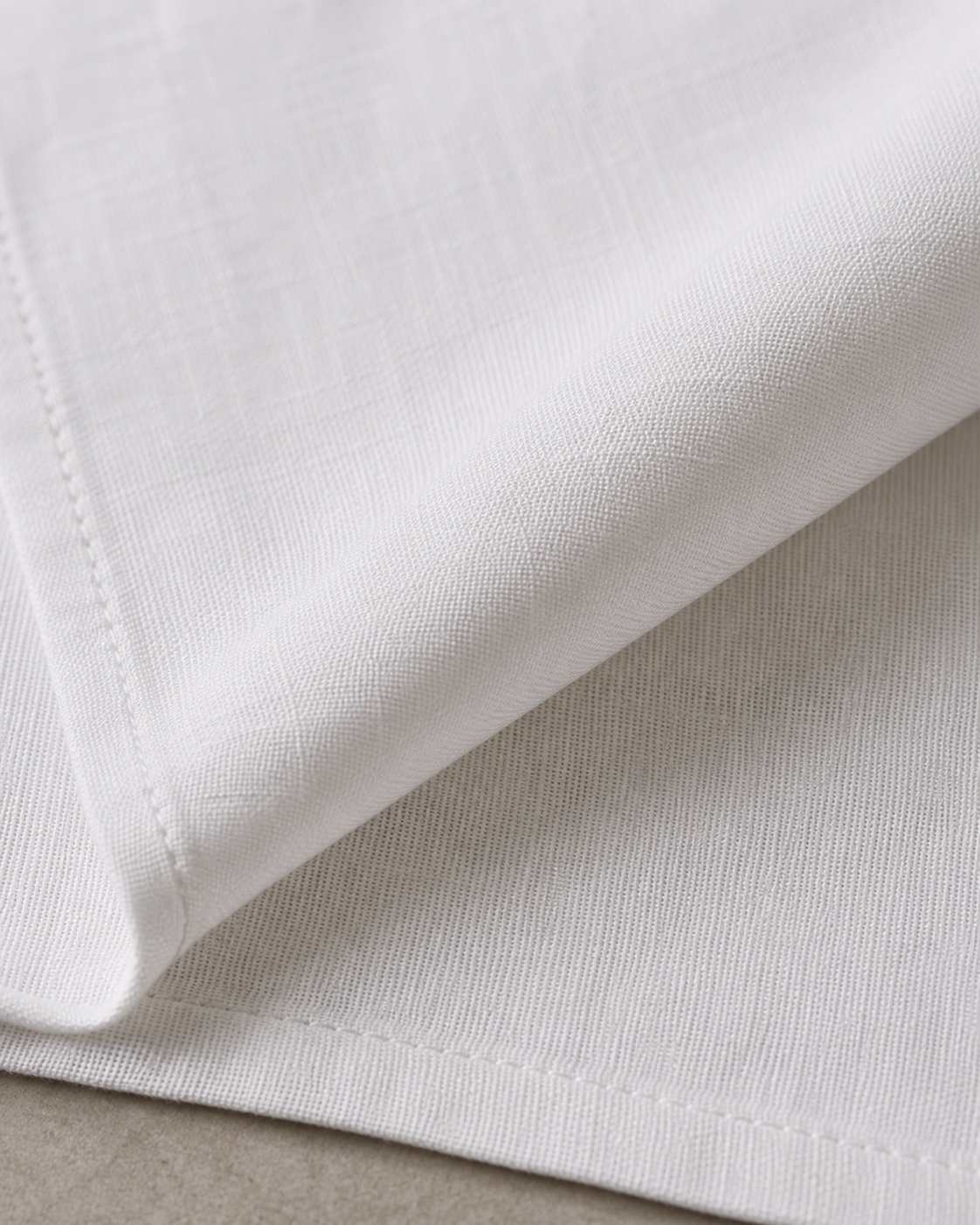 Close-up of the white 225 GSM Premium Linen slub weave fabric