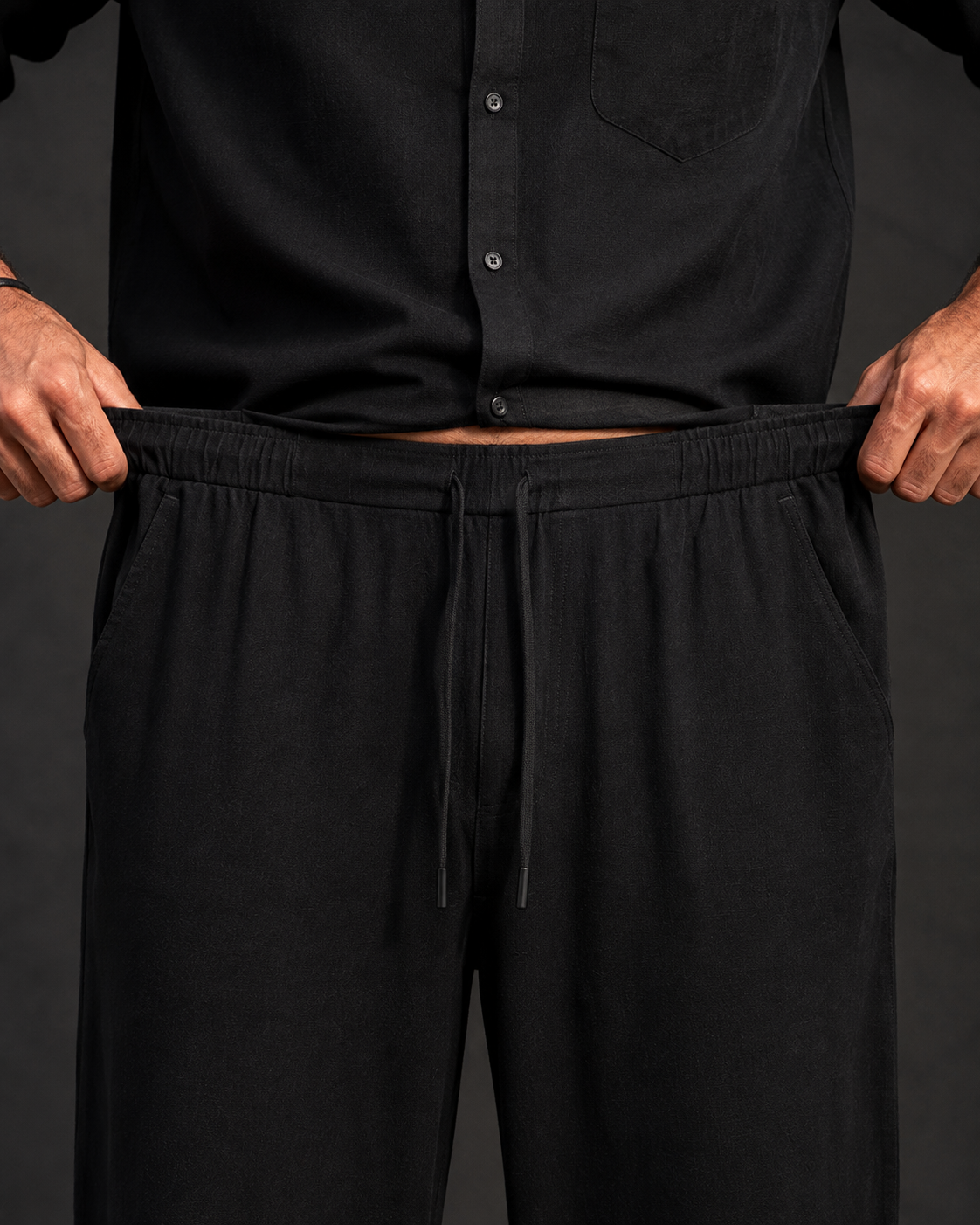 Men's black Premium Linen co-ord set showing the relaxed shirt and trouser silhouette
